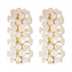 Pair of brass sconces with white glass disk design